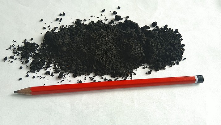 Solid carbon (resulting from the conversion of CO2 in a LaNDER³ plant) - comparison with pencil to illustrate the fine grain size