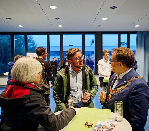 Guests chat at the champagne reception.