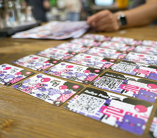 Rally cards lie on a table.