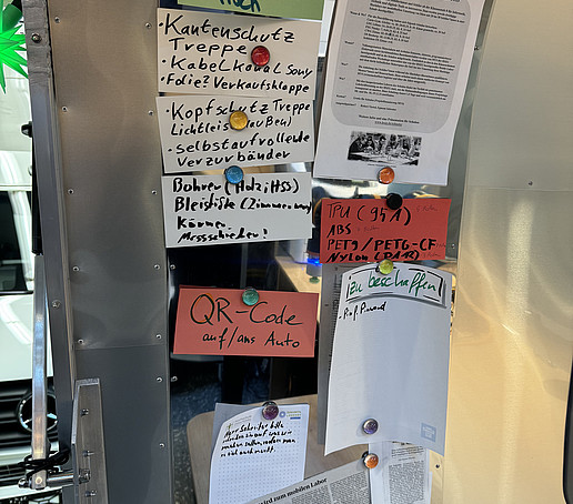 Notes are attached to one side of the AirStream trailer.