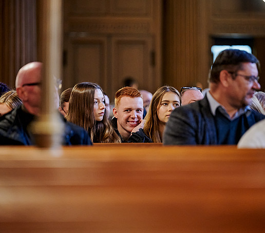 Row of seats in the church with guests.