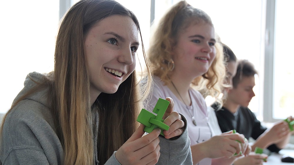 Pupils at a school event on the topic of 3D printing