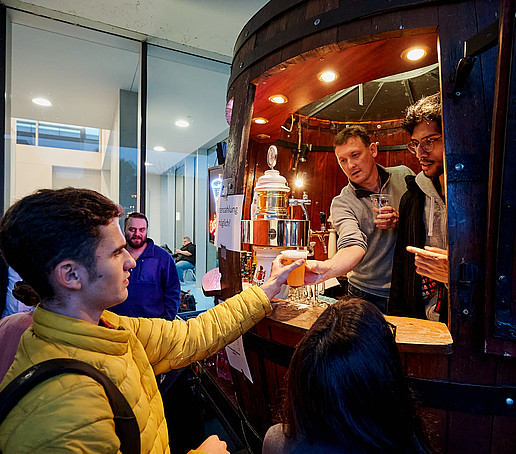 A guest is served a drink.