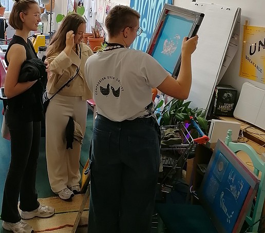 Students look at screen printing plates.