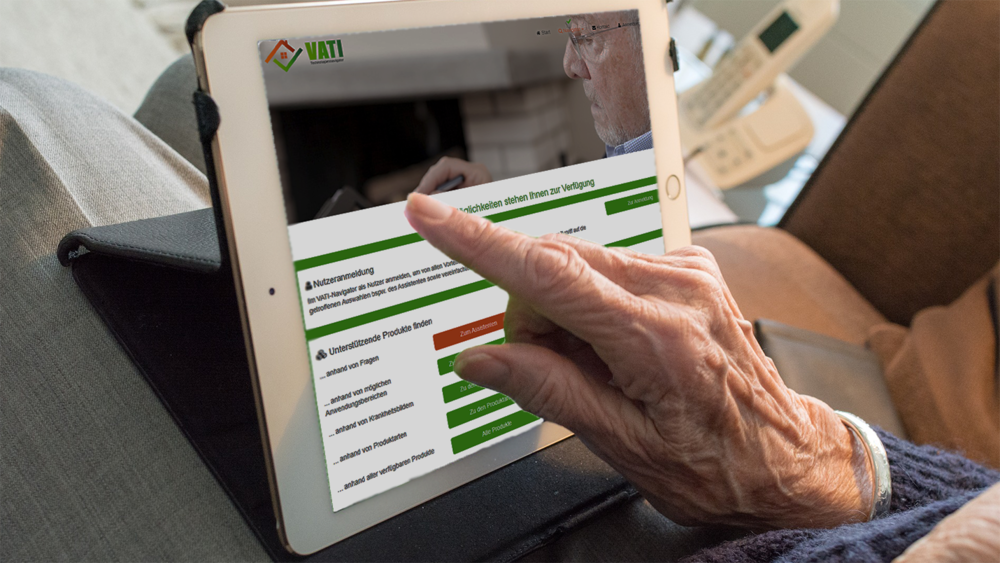 An elderly person's hand moves across the screen of a tablet to find out about assistance technology in home care.