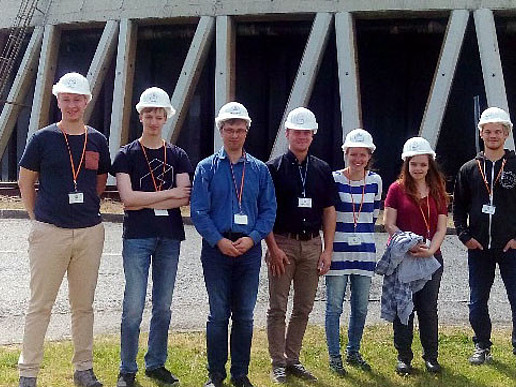Group photo in front of one of the wet cooling towers