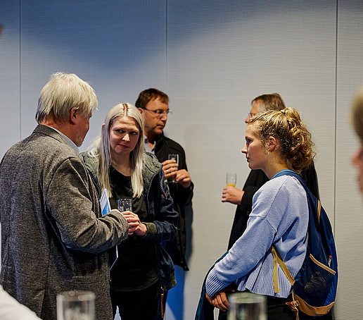 Guests chat at the champagne reception.