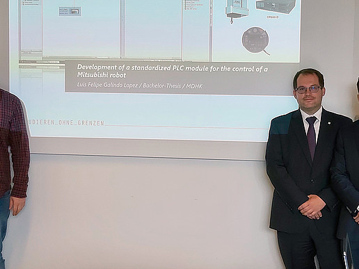 Christian Vogel, Prof. Dr. Alexander Kratzsch and Luis Lopez in front of a presentation