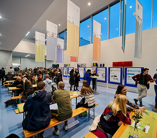 Guests sit in the packed foyer of Z 4.