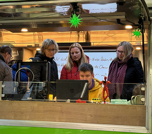 Guests take a look at the interior of the AirStream trailer.