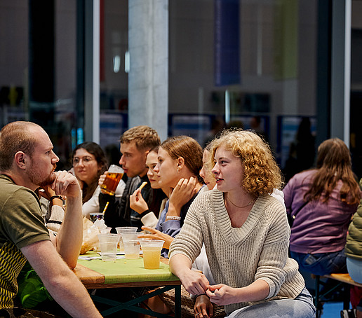 Guests sit in the foyer and chat.